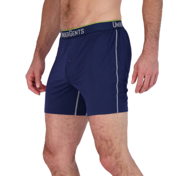 side view on model of undergents navy blue boxer short. nothing feels better than freedom underneath.